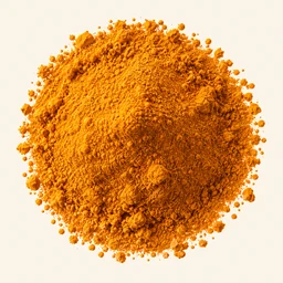 A mound of turmeric on a warm cream background.