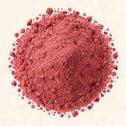 A mound of rose petal on a warm cream background.